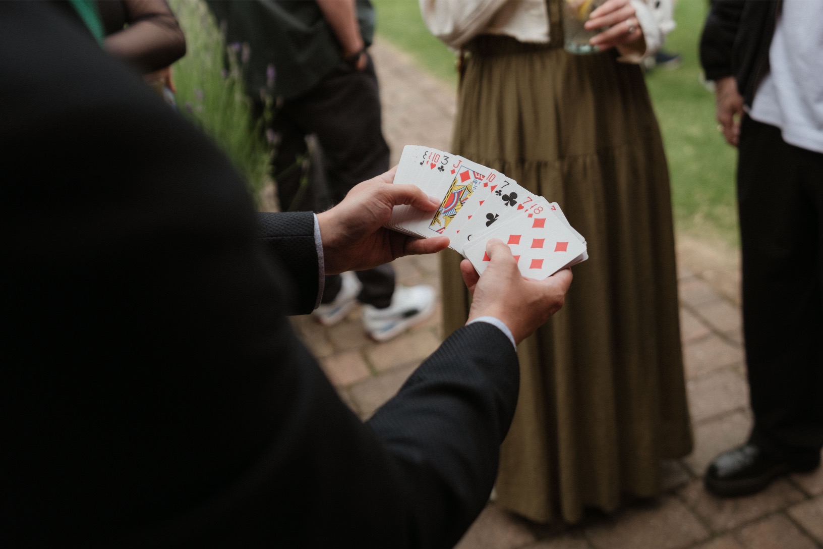 Guests enjoying close-up magic at an event